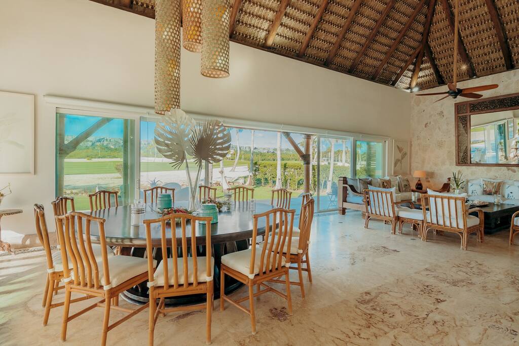 The living area of this villa exudes elegance and comfort, with plush sofas and stylish decor creating a welcoming atmosphere.